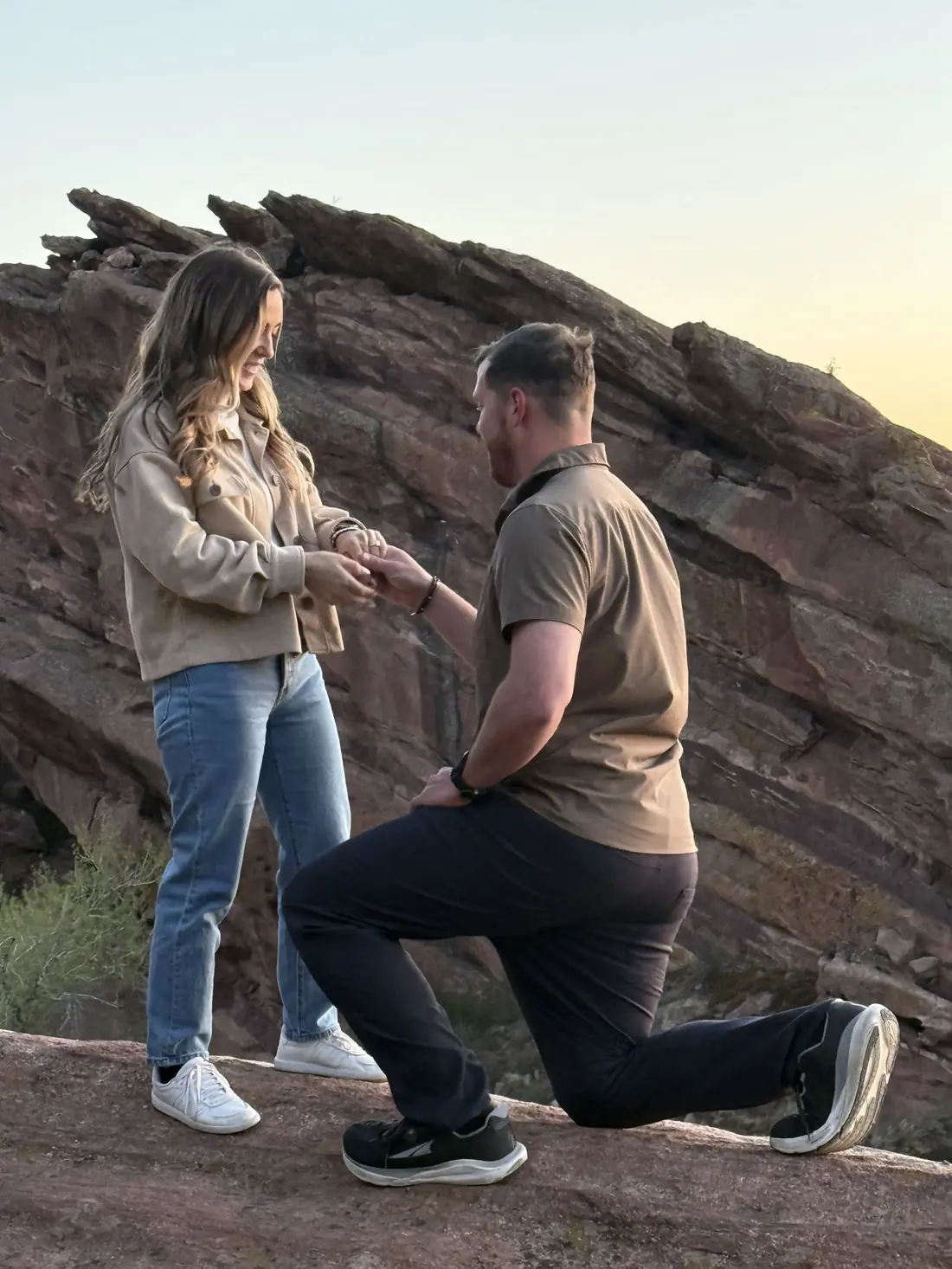 Jeffrey proposing to Robin on a red rock ridge at sunset
